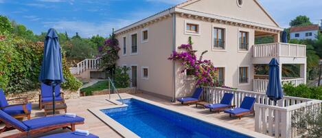 Seasonal outdoor pool, pool umbrellas, pool loungers