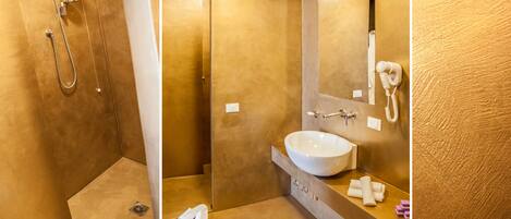 A bathroom with a shower, a sink, and a mirror.