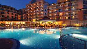 A hotel with multiple balconies, a swimming pool, and outdoor seating areas. - Hotel & SPA Diamant Residence - All Inclusive (Sunny Beach)