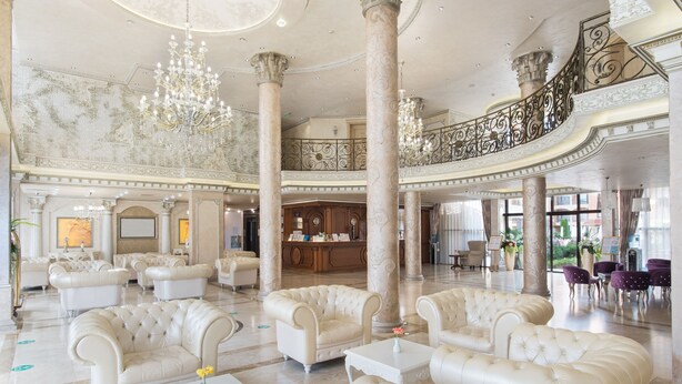 A grand lobby with plush seating, ornate columns, and a grand staircase. - Hotel & SPA Diamant Residence - All Inclusive (Sunny Beach)