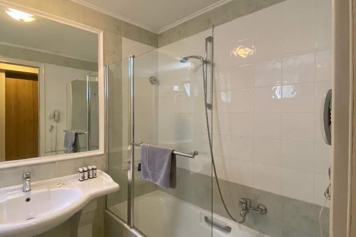 superior double room | bathroom | hair dryer, towels