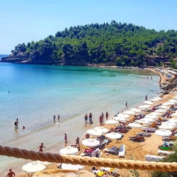 On the beach, sun-loungers, beach umbrellas, beach towels