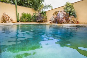 Seasonal outdoor pool, pool loungers