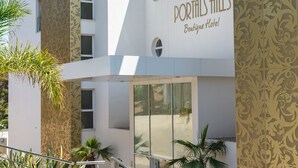 A modern building with a sign reading "Portals Hills Boutique Hotel". - Portals Hills Boutique Hotel (Calvia)