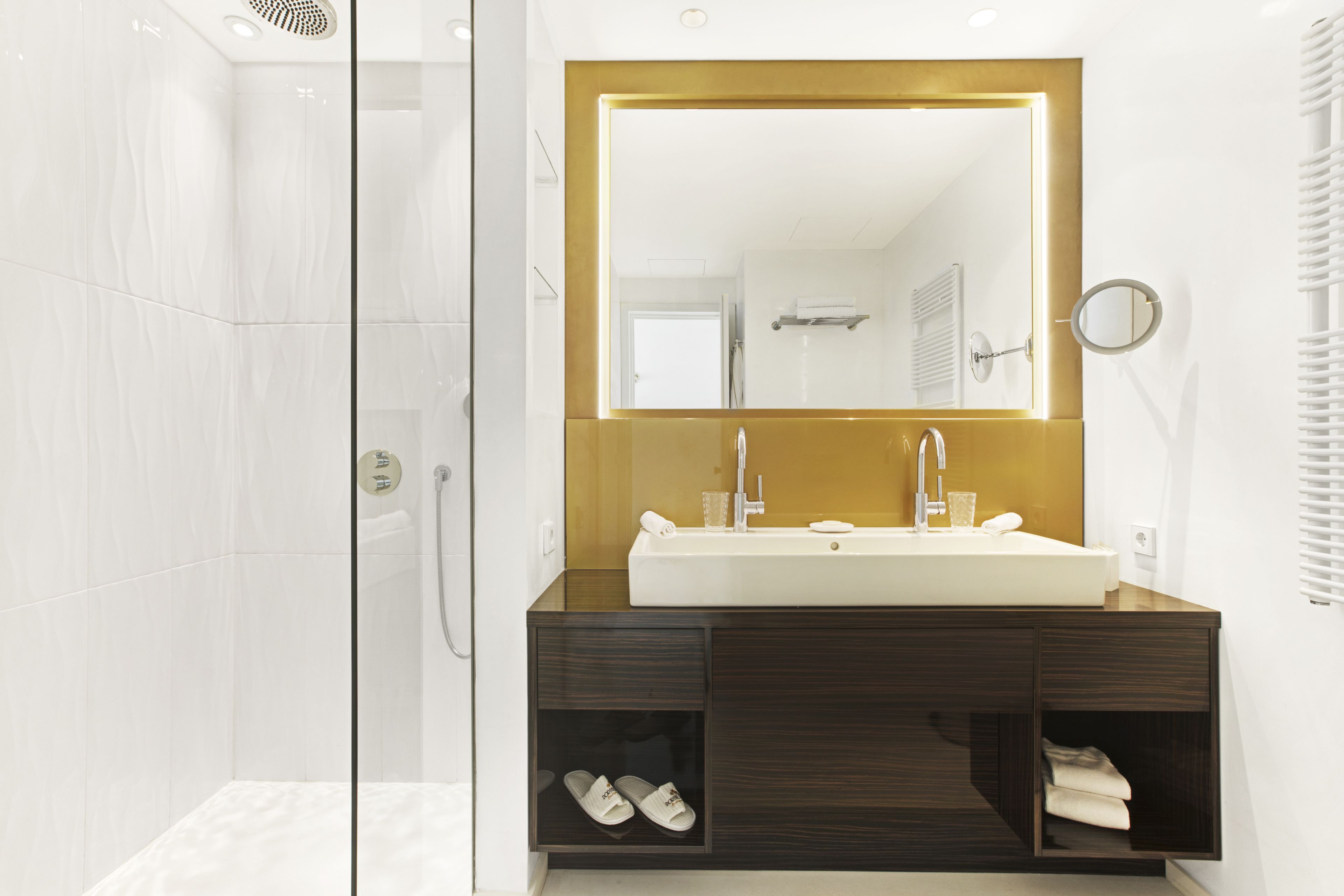 designer toiletries, hair dryer, bathrobes, slippers