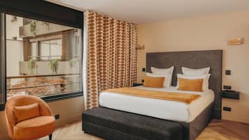 Premium bedding, in-room safe, blackout curtains, soundproofing