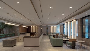 A spacious lobby with a central island, seating areas, and large windows. - Holiday Inn Beijing Daxing Movie Park by IHG (Daxing)