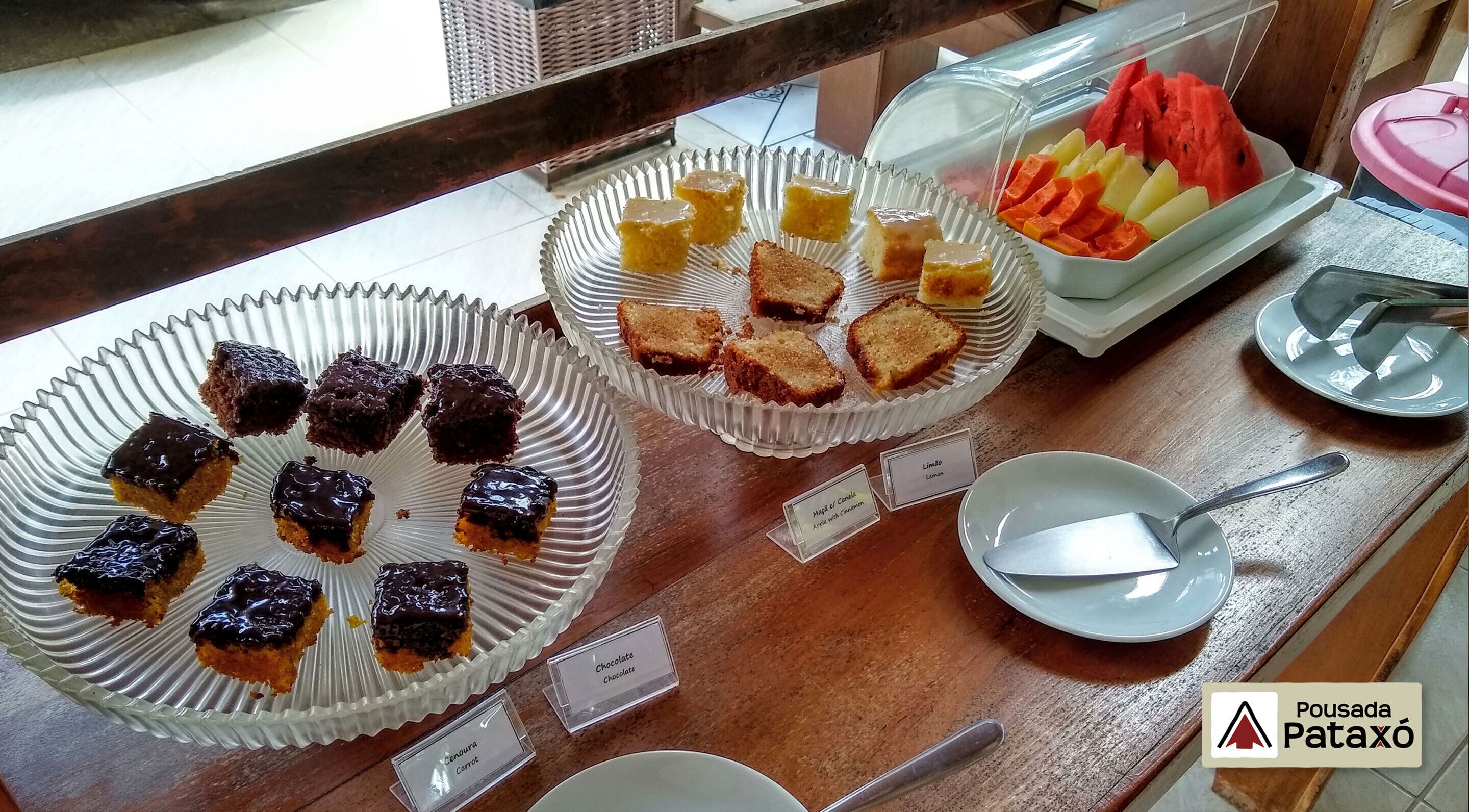 A buffet with various desserts and fruits.