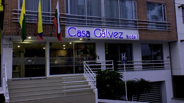 A multi-story building with a sign reading "Casa Galvez hotel."