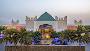 A hotel with a distinctive castle-like architecture, featuring a central tower and two side towers. - Radisson Blu Resort, Jizan (Jizan)