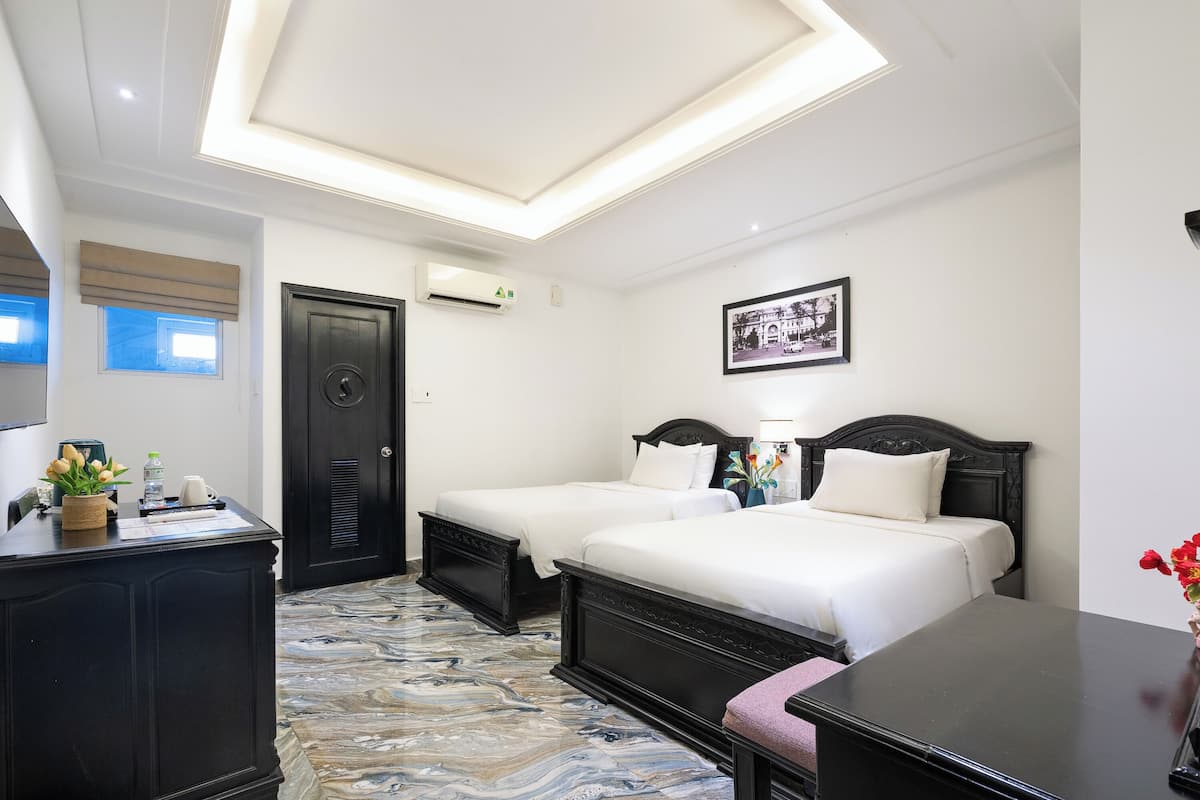 Camera Deluxe con 2 letti singoli | Biancheria da letto ipoallergenica, minibar, una cassaforte in camera