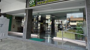 A hotel entrance with a sign reading "GV Hotels" and a website address. - GV Hotel Davao (Davao)