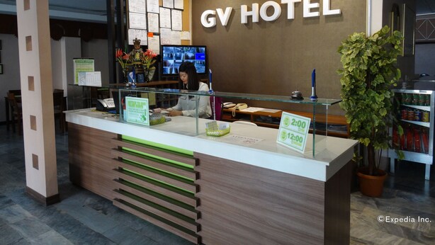 A hotel reception desk with a sign reading "GV HOTEL". - GV Hotel Davao (Davao)