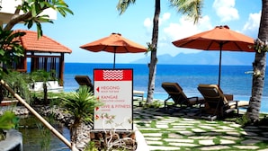 A resort with a sign indicating locations such as the Hegong Roof Top Bar, Kangae Executive Lounge, and Dive & Fitness Center. - Capa Maumere (Maumere)