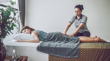 Experience a soothing massage in a serene space with a professional therapist.