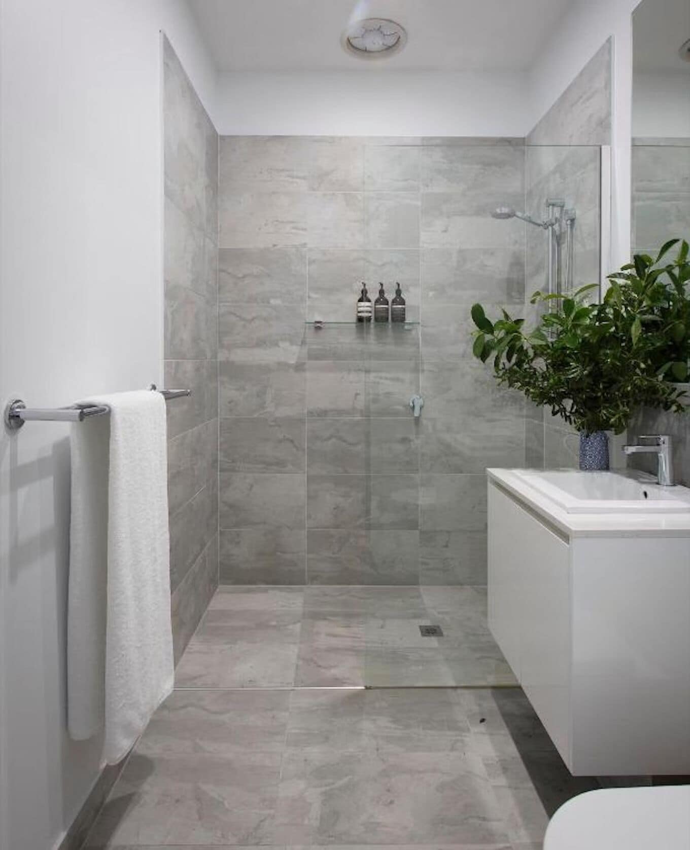 Shower, designer toiletries, hair dryer, towels