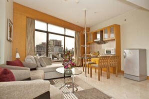 Studio Apartment Suite | Living area | 42-inch LCD TV with cable channels, TV