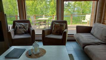 Appartement, 3 chambres, sauna | Coin séjour | Télévision à écran plat, cheminée