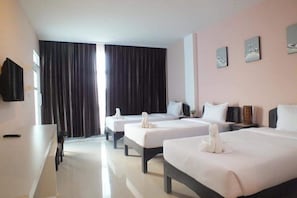 Deluxe Room, Multiple Beds, Non Smoking, Corner | Individually decorated, individually furnished, desk, laptop workspace