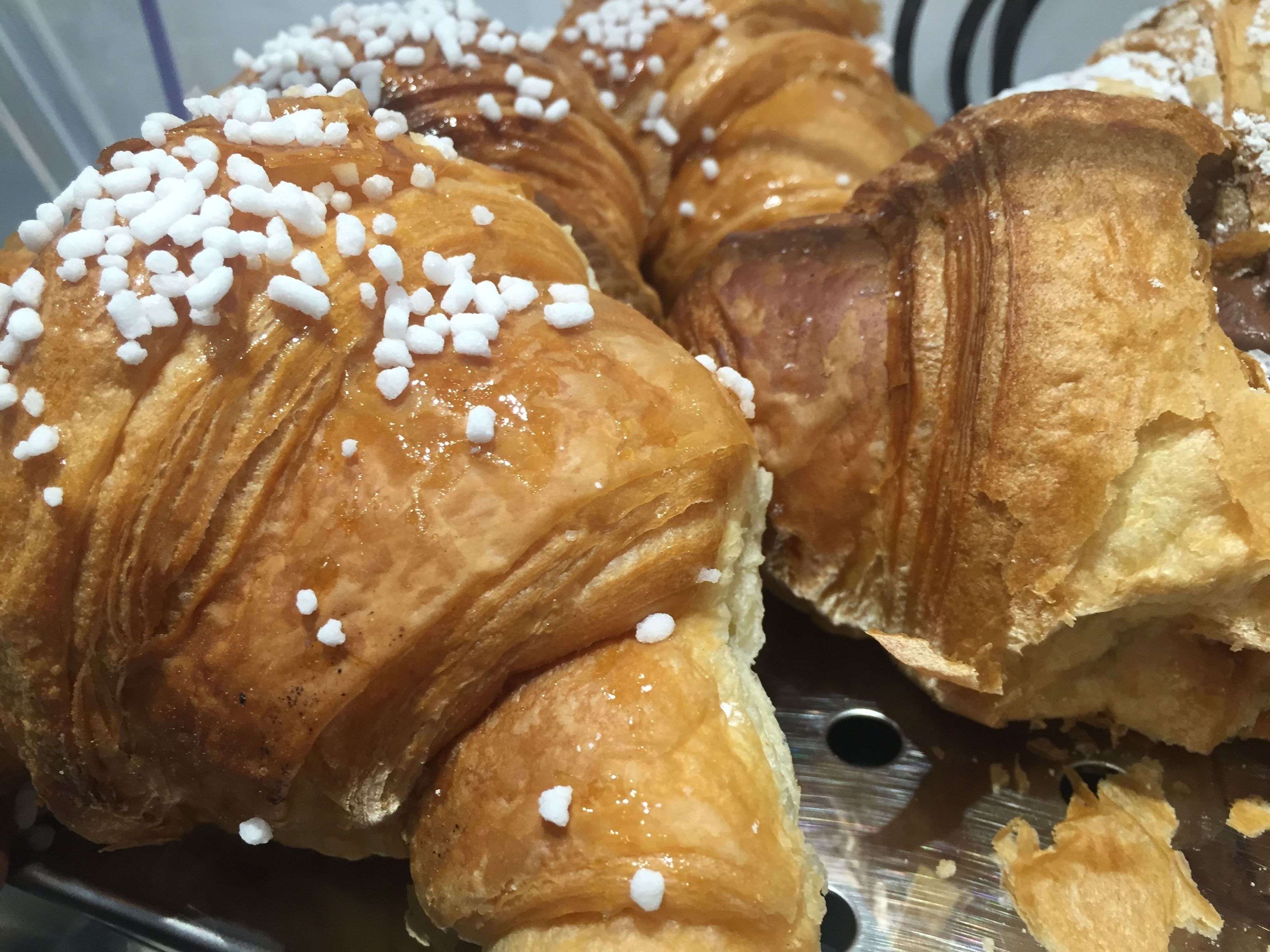 A close-up of pastries with white sugar sprinkles.