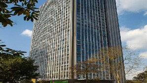 A tall, modern building with a grid of windows and a flat roof. - Antai Century Hotel (Chengdu)