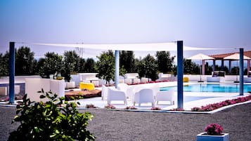 Indoor pool, outdoor pool, pool umbrellas, pool loungers