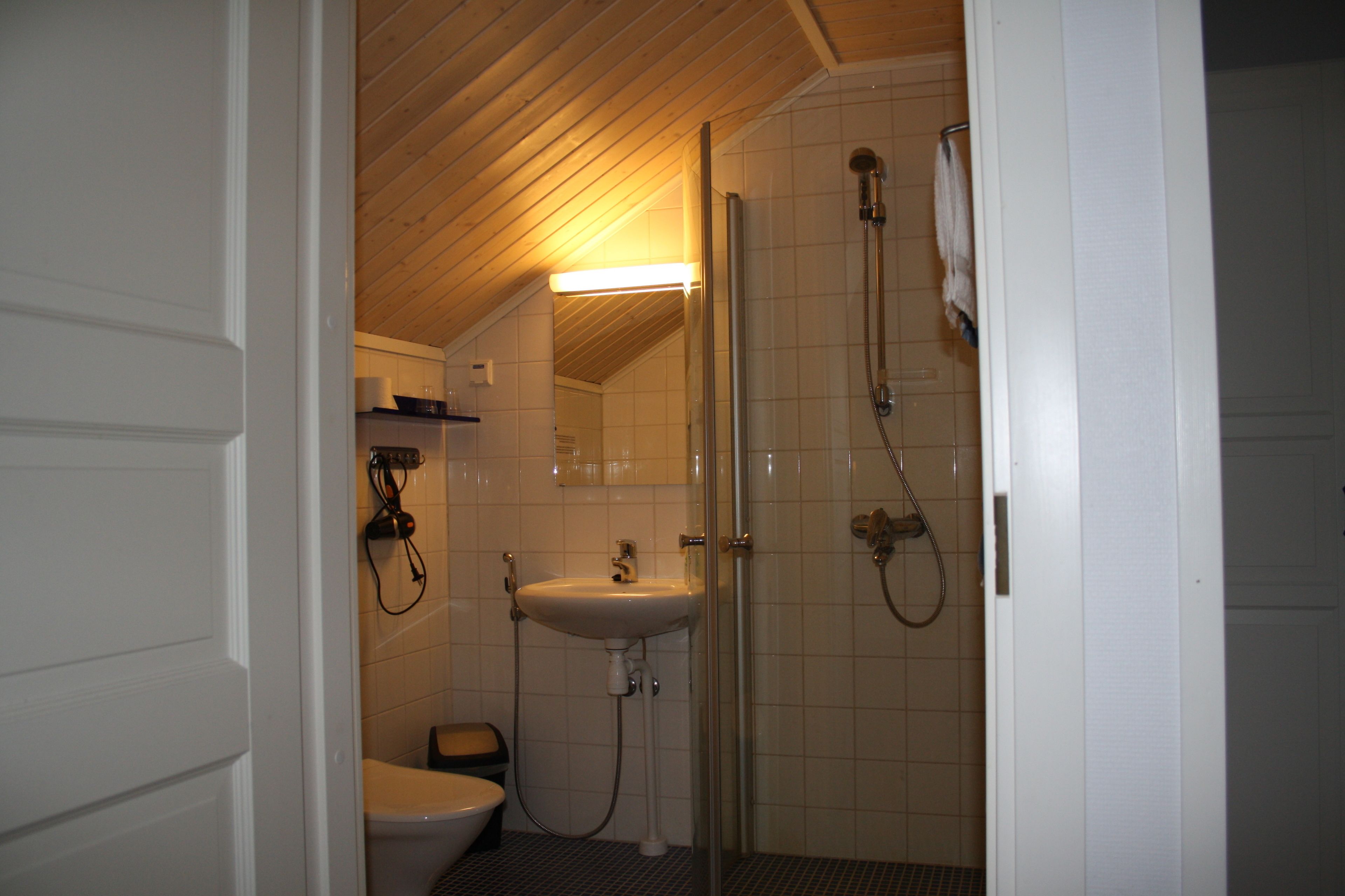 deluxe twin room, garden view | bathroom | shower, rainfall showerhead, hair dryer, towels