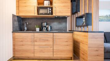 Apartamento, sacada | Cozinha privada