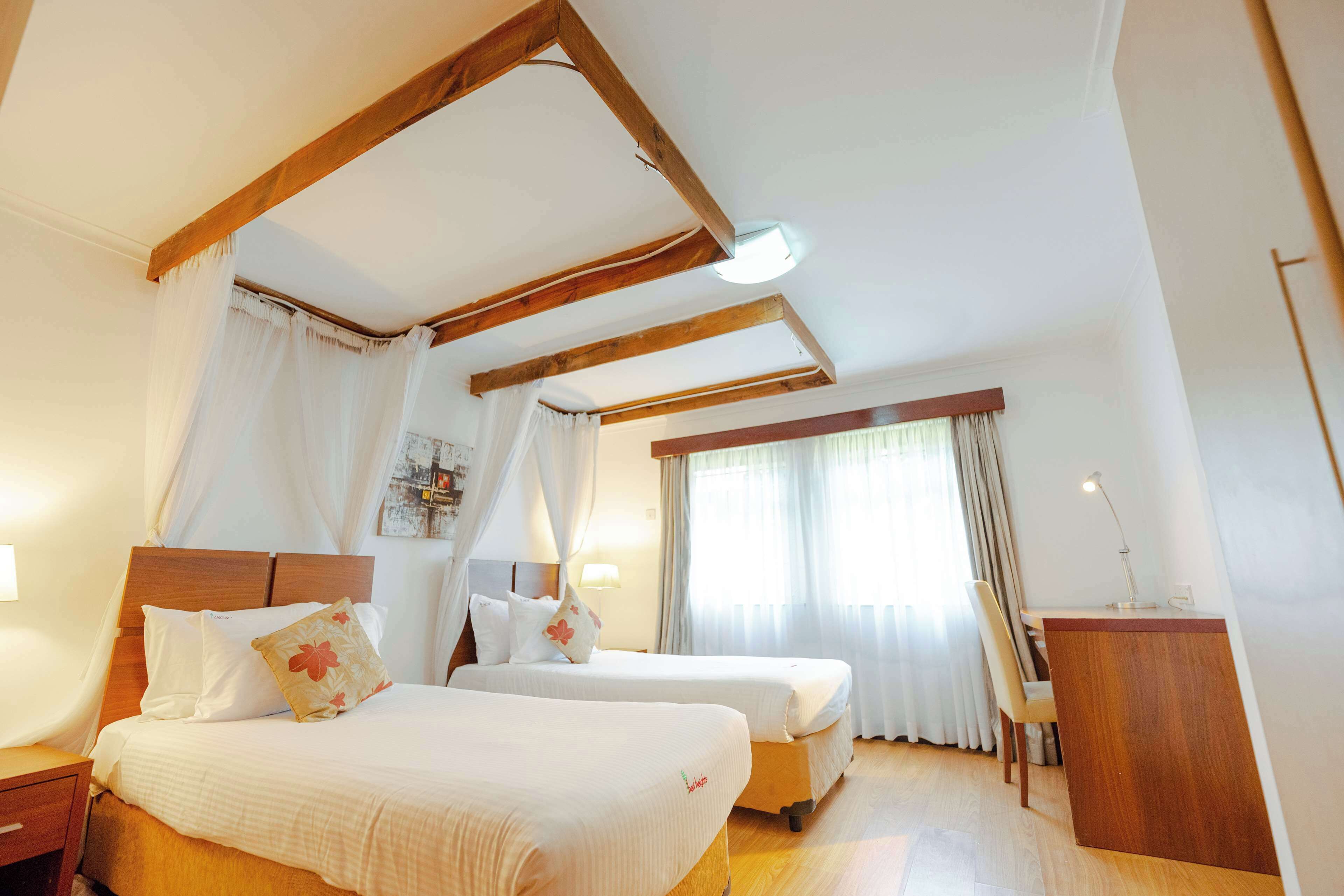 Luxe beddengoed, donsdekens, pillowtop-bedden, een kluis op de kamer