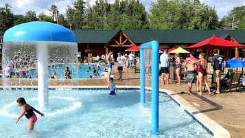 Relax by the pool surrounded by lush surroundings and soothing water features.