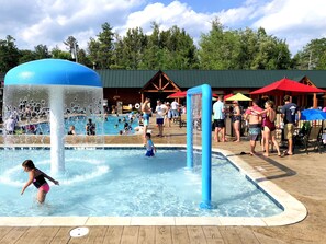 Seasonal outdoor pool, open 9:00 AM to 8:00 PM, pool umbrellas