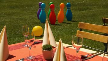 A table set outdoors with a green lawn in the background.