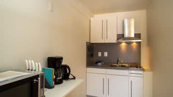 Studio | Private kitchenette | Full-sized fridge, stovetop, coffee/tea maker, electric kettle