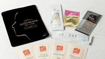 A variety of personal care products including a face wash, liquid cleanser, and a hair mask.