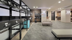 A modern hotel lobby with a seating area, a reception desk, and a luggage storage area. - Keio Presso Inn Ikebukuro (Tokyo)