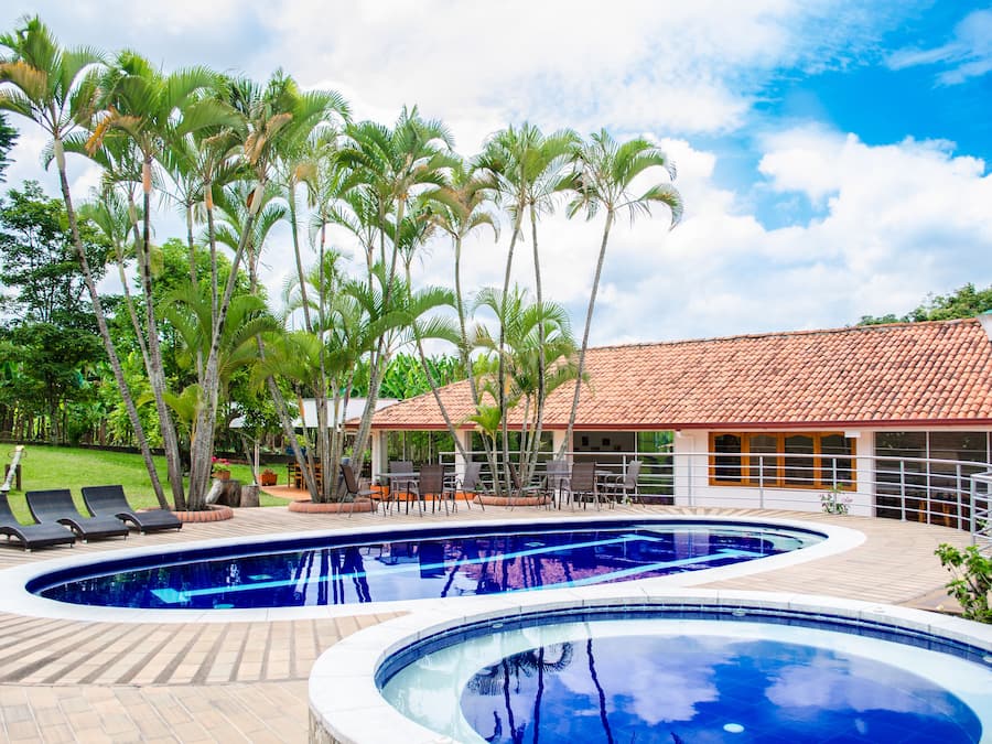 Outdoor pool, open 9:00 AM to 9:00 PM, pool loungers