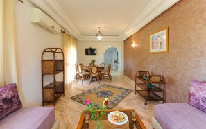 Family Apartment | Living area | 55-inch flat-screen TV with satellite channels, TV - In Club Palmeraie Resort (Marrakech)