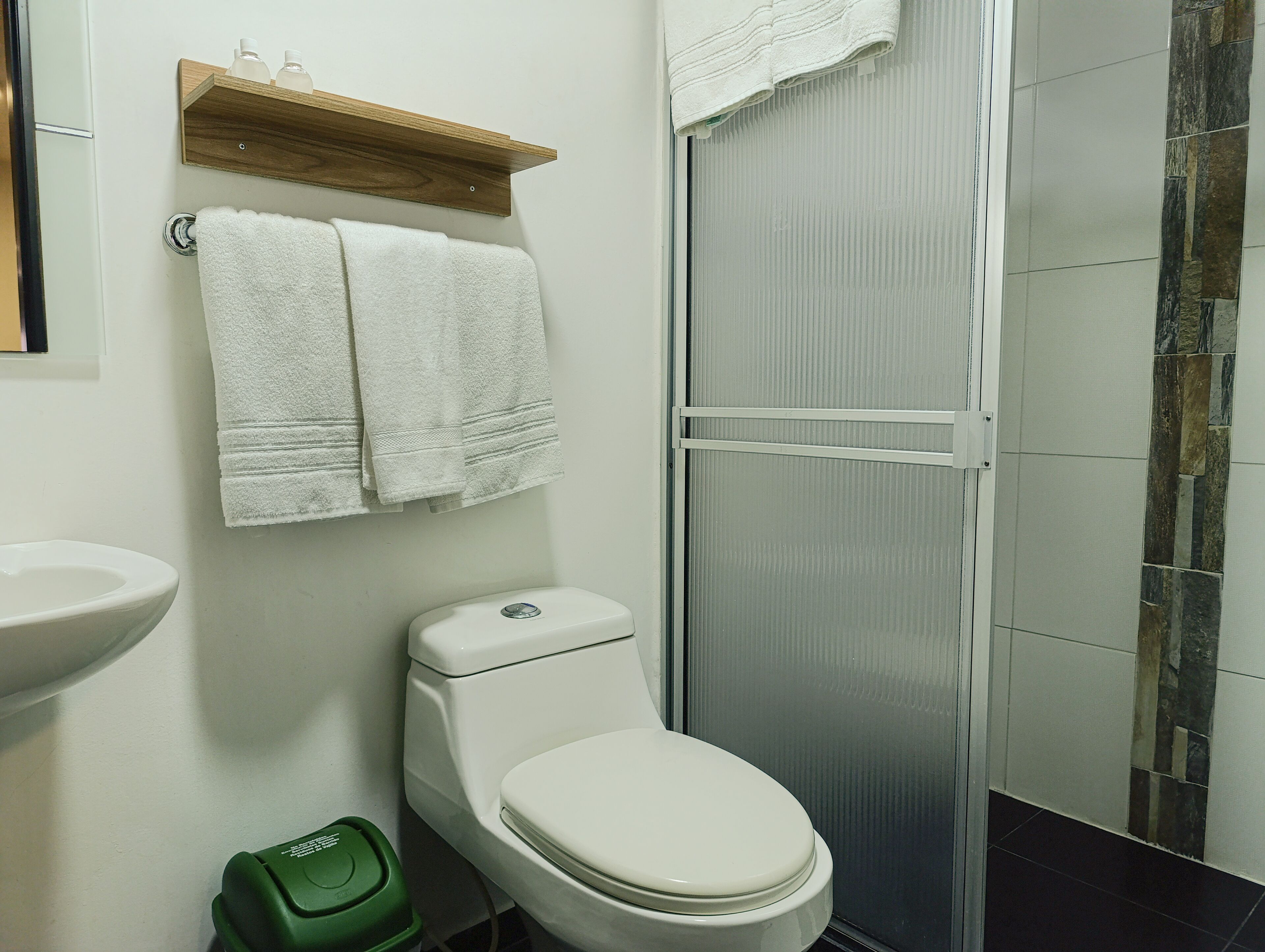 standard quadruple room, multiple beds | bathroom | shower, designer toiletries, hair dryer, towels