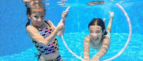 2 outdoor pools, pool umbrellas, pool loungers