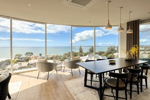 Superior Three Bedroom Apartment with Sea View | Living area | 40-inch flat-screen TV with digital channels - Marsden Suites Nautilus Orewa (Orewa)
