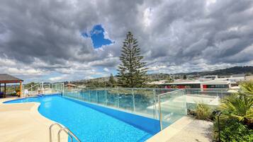 Seasonal outdoor pool, pool loungers