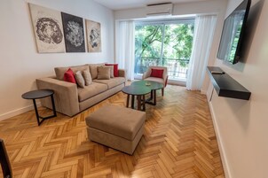 Superior Apartment, 2 Bedrooms | Living area | 32-inch LCD TV with cable channels, TV, pay movies