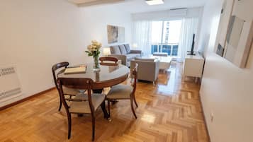 Superior Apartment, 3 Bedrooms | Living area | 32-inch LCD TV with cable channels, TV, pay films