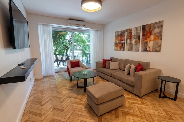 Superior Apartment, 3 Bedrooms | Living area | 32-inch LCD TV with cable channels, TV, pay films