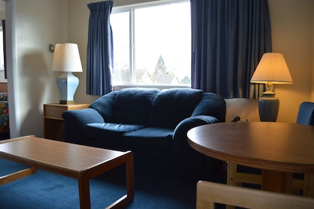 Suite, 1 Queen Bed | Living area | TV
