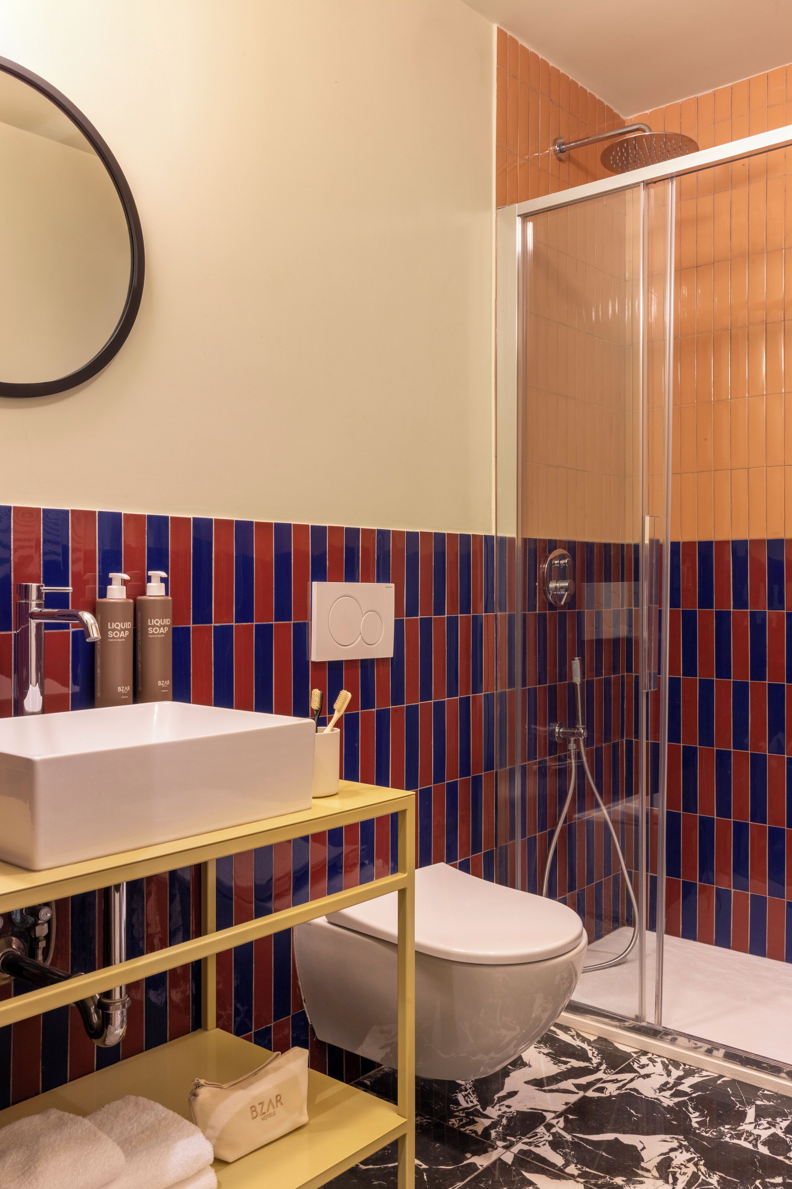 A bathroom with a bathtub, a sink, and a shower.