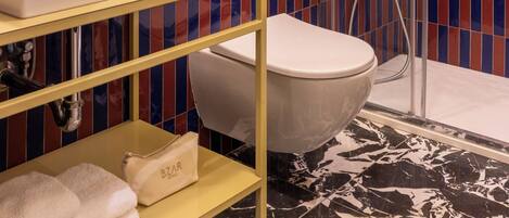 A bathroom with a bathtub, a sink, and a shower.