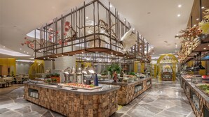 A modern restaurant with a central island counter, decorative ceiling elements, and a polished stone floor. -  Hangzhou Xingdu Hotel (Hangzhou)