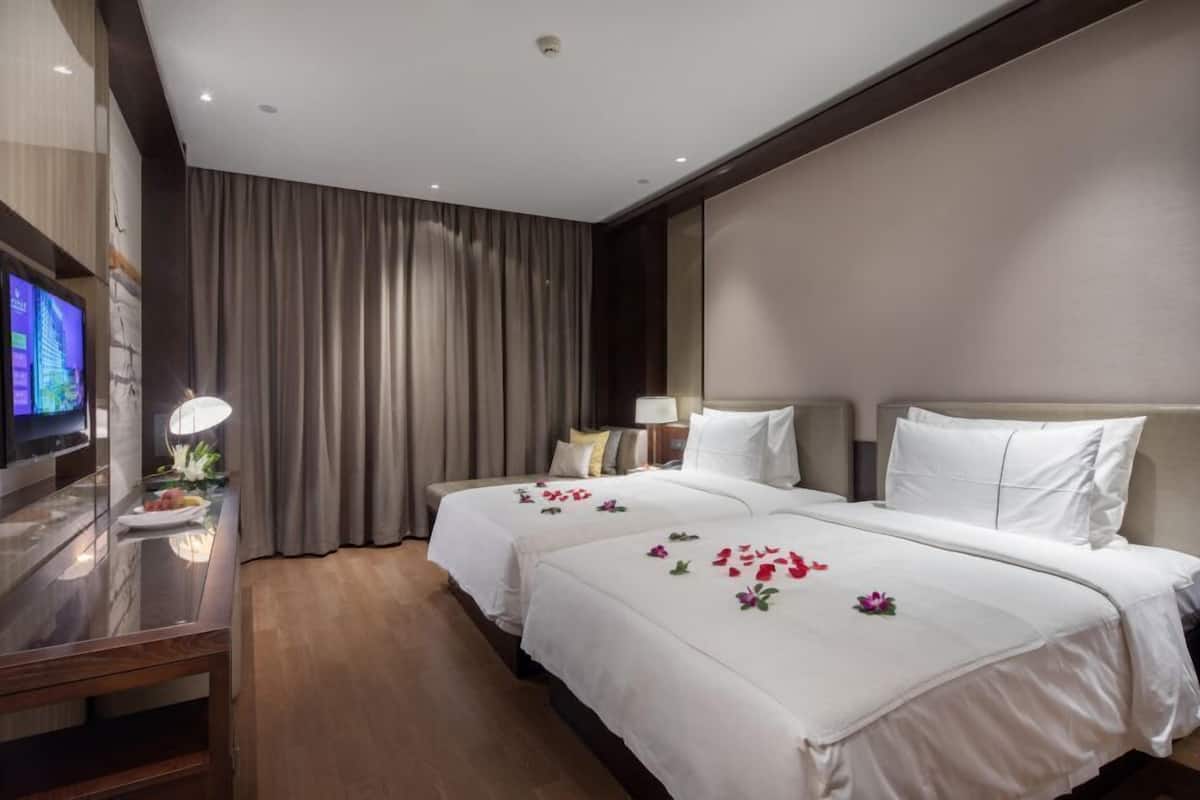Habitación Deluxe con 2 camas individuales | 1 dormitorio, ropa de cama de alta calidad, minibar y caja fuerte