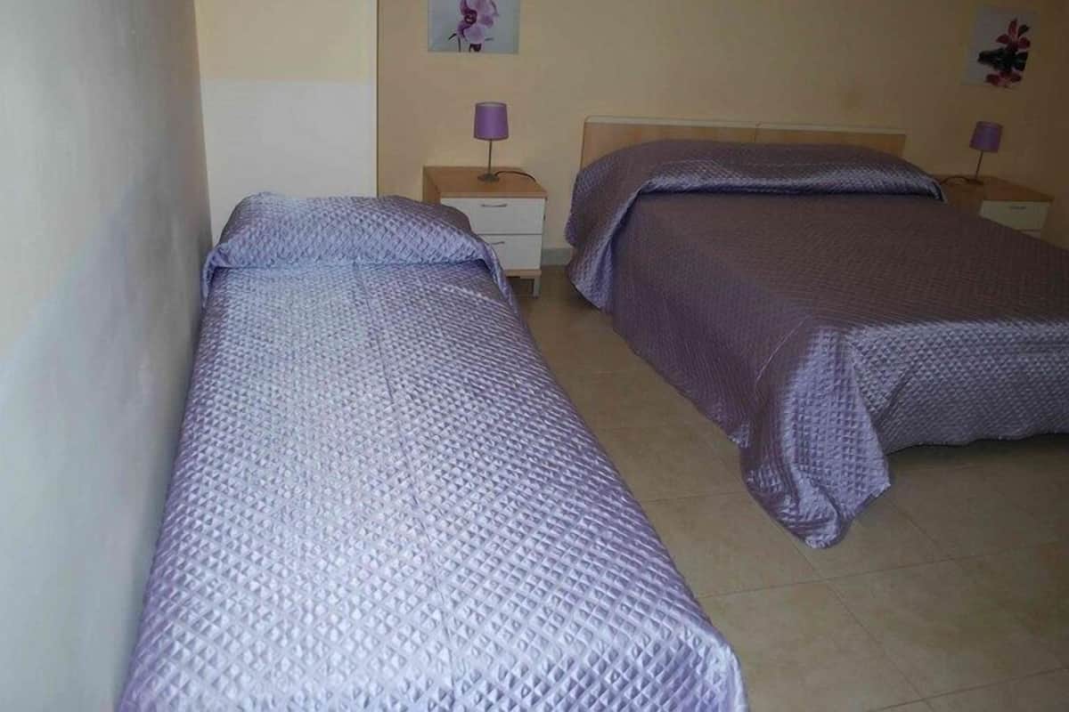 Triple Room, Garden View | In-room safe, individually decorated, individually furnished, desk